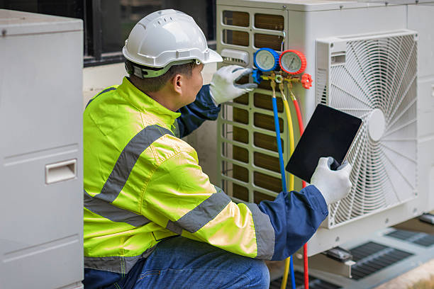 Professional Air Duct Cleaning technician working in White Hall, IL